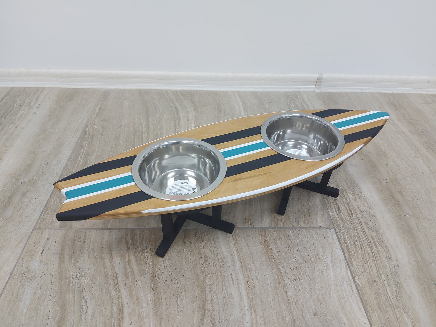 Custom surfboard wooden bowl holder placed on floor with dog food and water