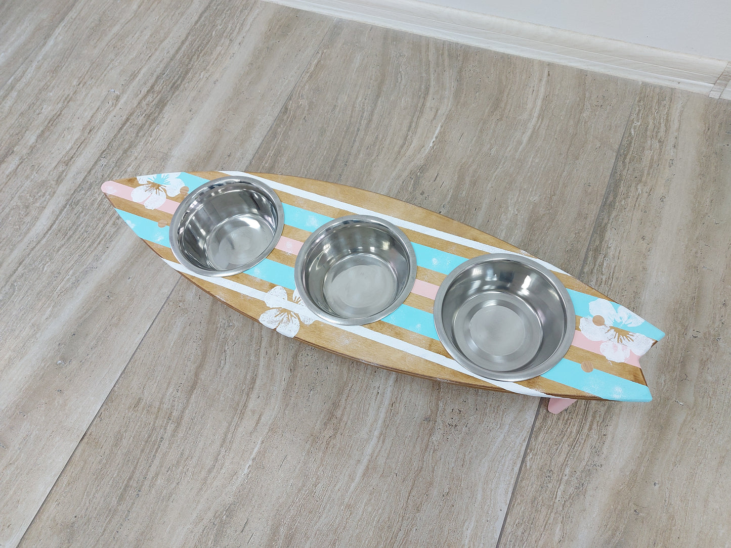 Pet feeding bench with painted flowers in surf-themed interior