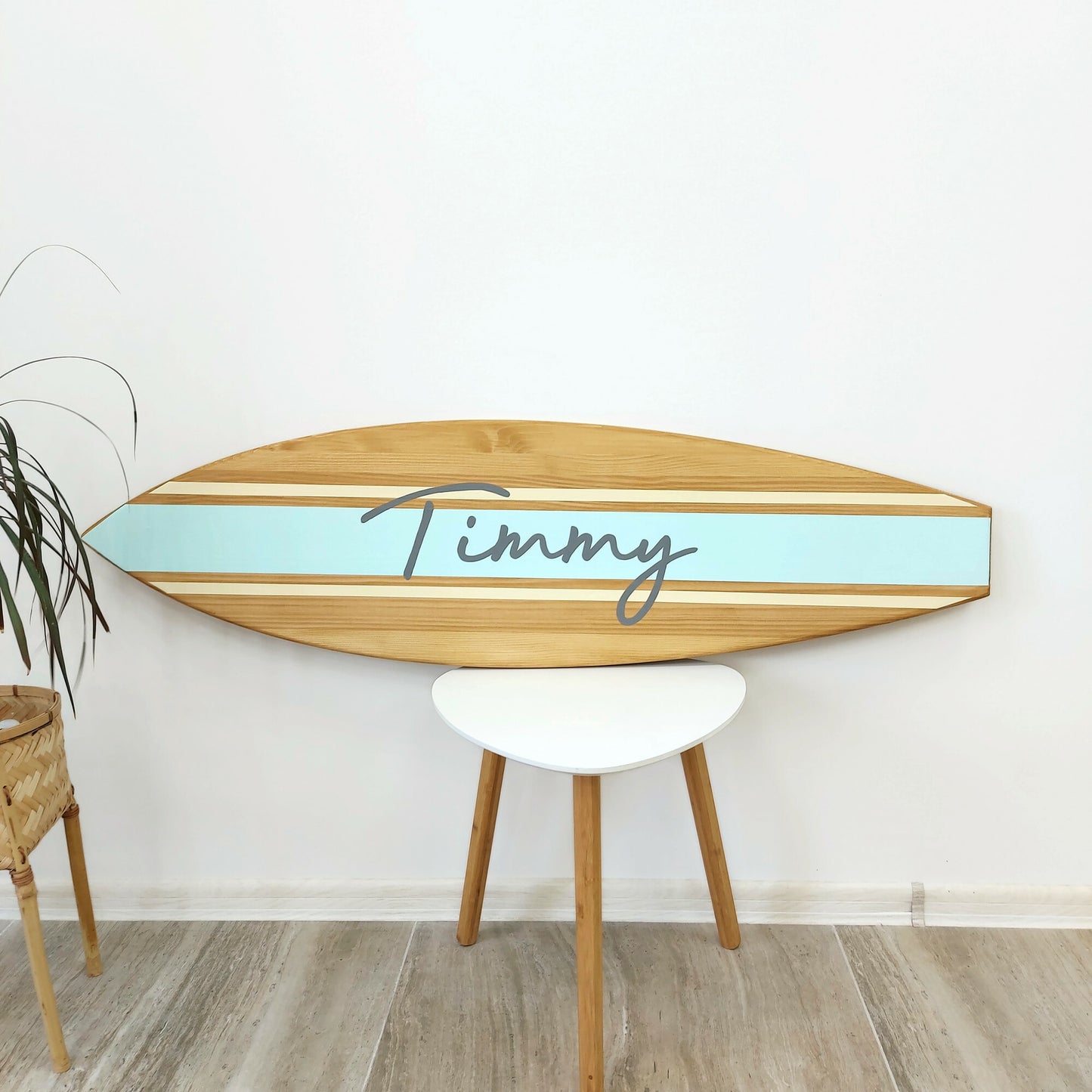 Handcrafted surfboard decor with name engraving in natural wood finish