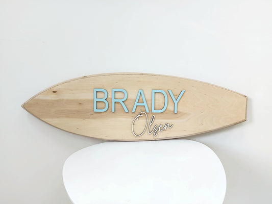 Custom surfboard decor with layered lettering for nursery or kids' room