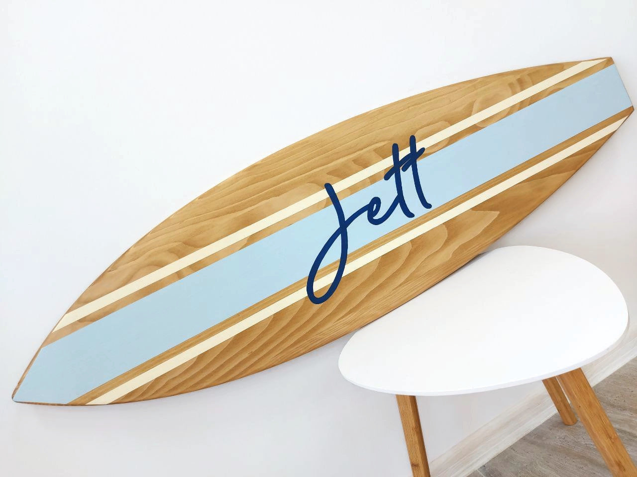 Custom surfboard name sign displayed in kids’ room or nursery