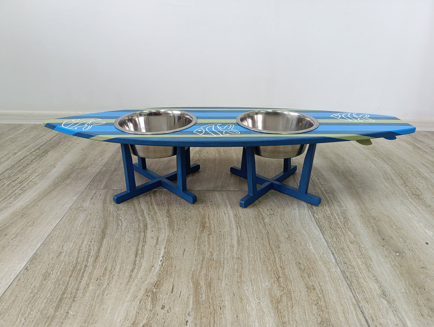 Personalized surfboard dog and cat bowl holder on wooden floor