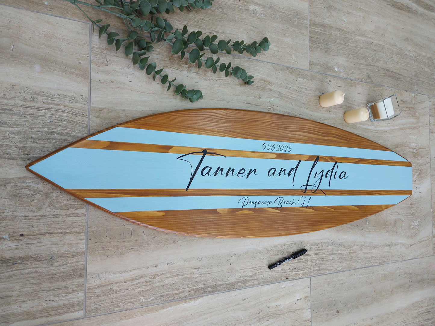 Wood surfboard wall decor used as wedding guest book