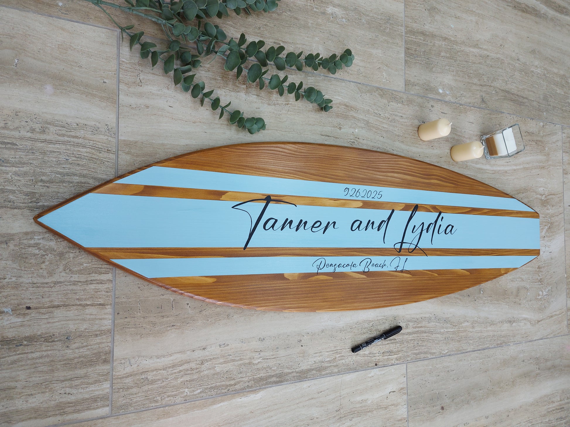 Wood surfboard wall decor used as wedding guest book