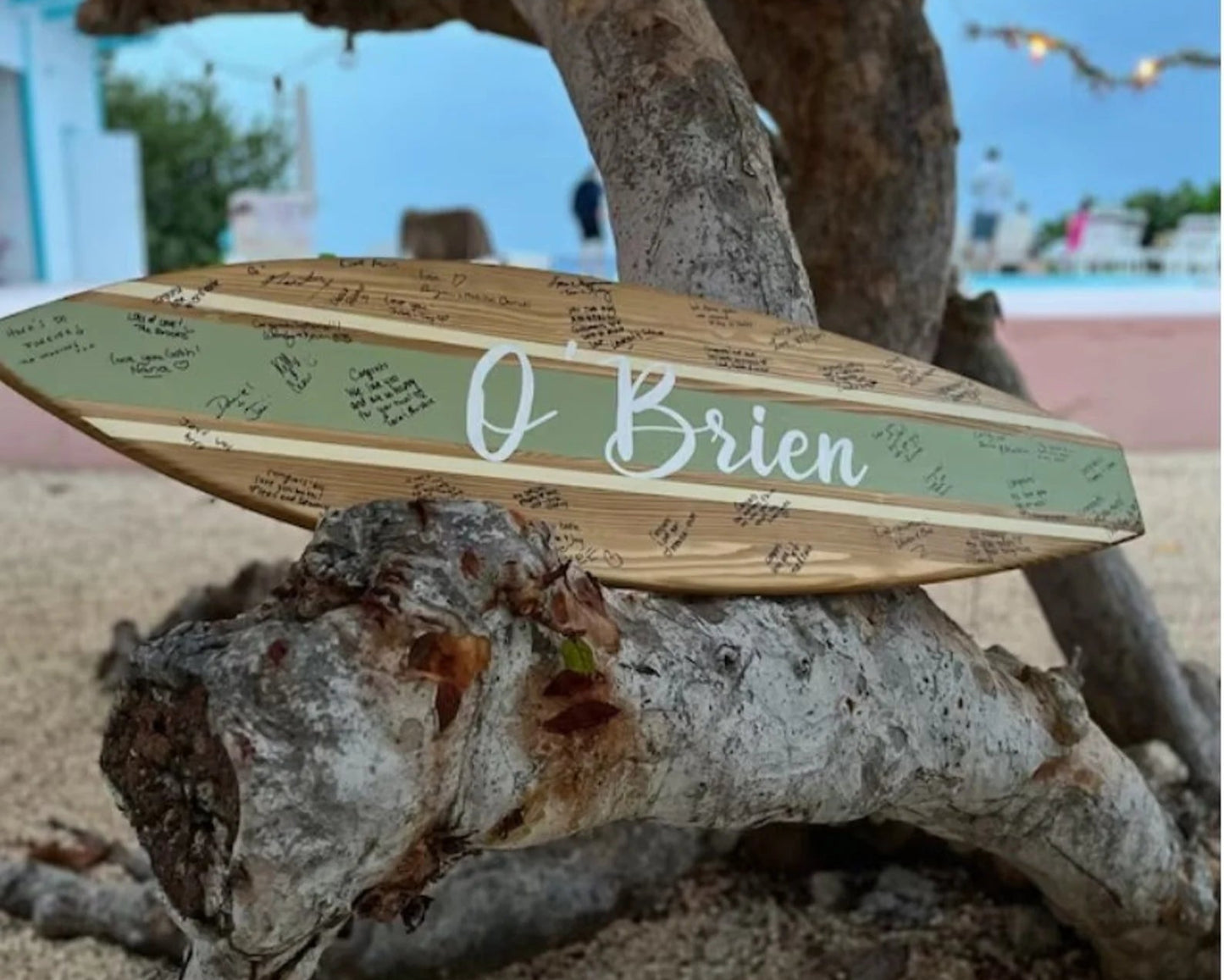 Custom wooden surfboard guest book for wedding decor front view on the beach wedding ceremony
