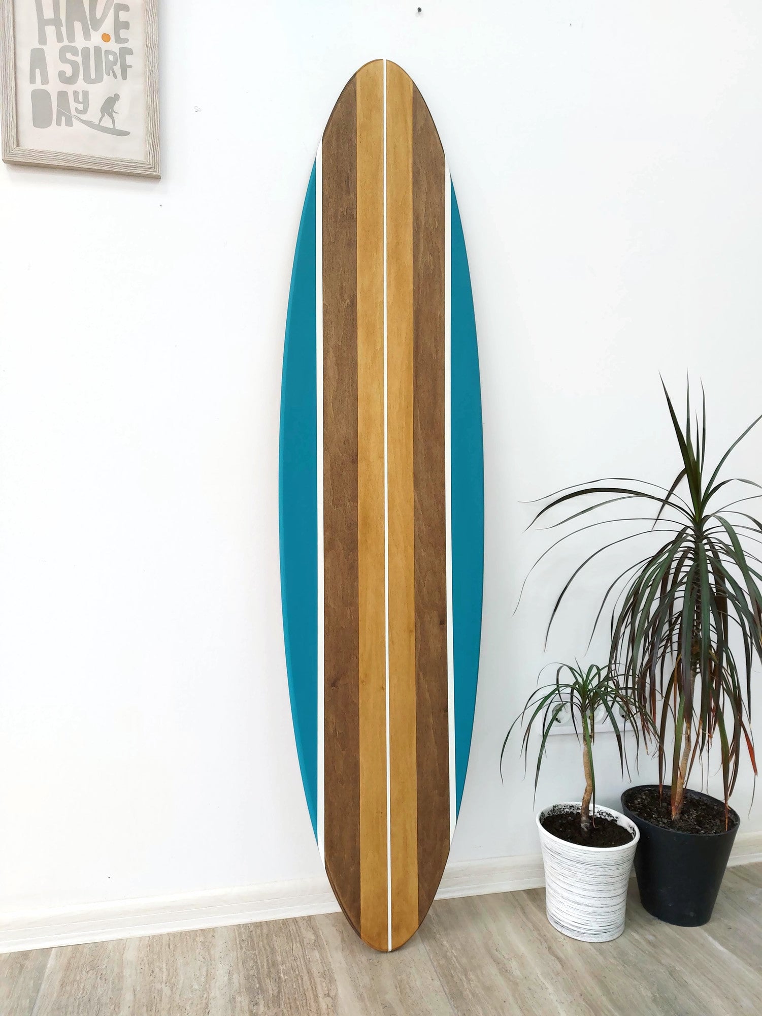 Wood surfboard wall décor hanging in coastal interior