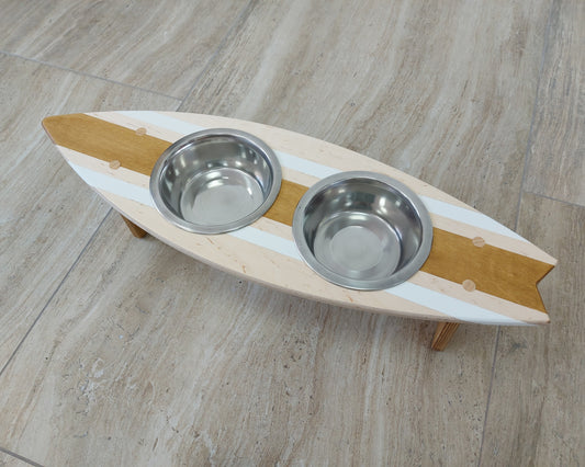 Personalized surfboard-shaped wooden dog and cat feeding stand painted with pet’s name
