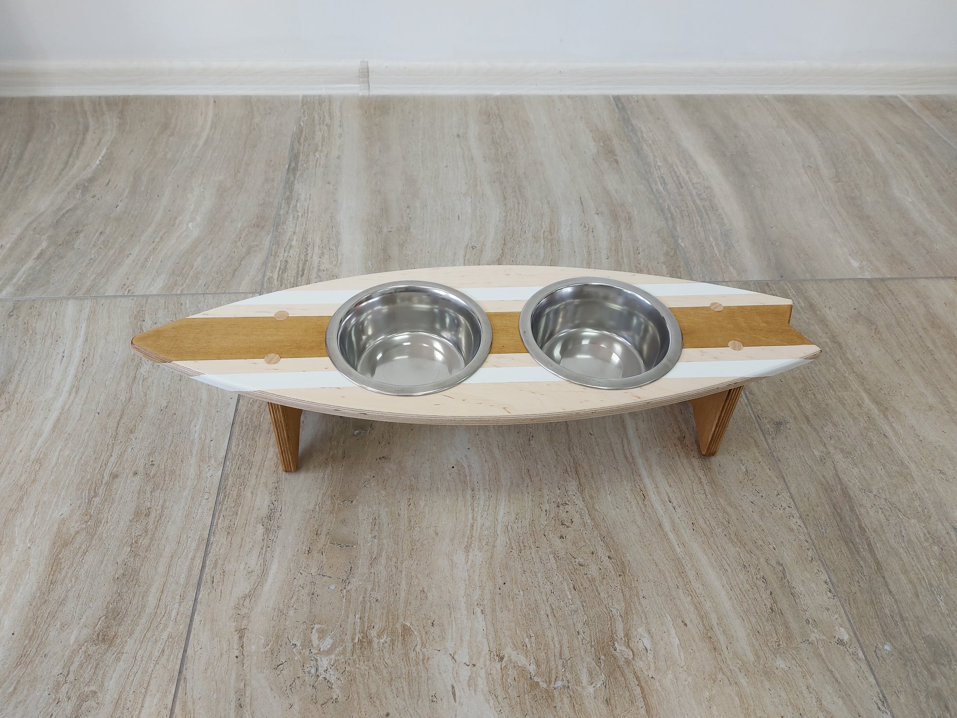 Surfboard-inspired personalized pet bowl holder ready for food and water