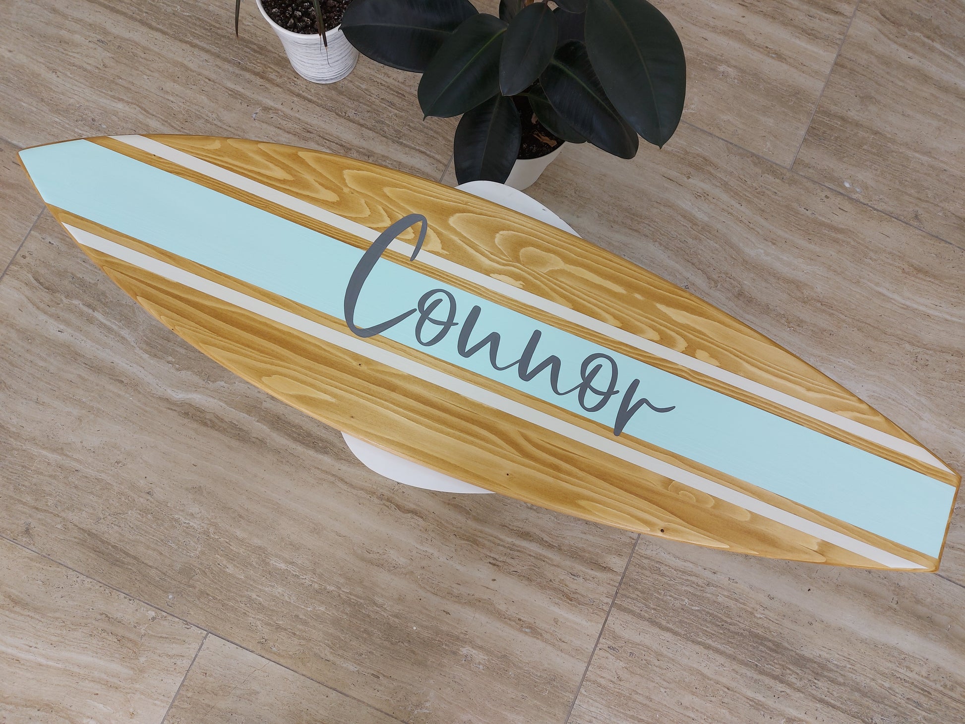 Coastal-inspired wooden name sign styled in kids’ room or playroom