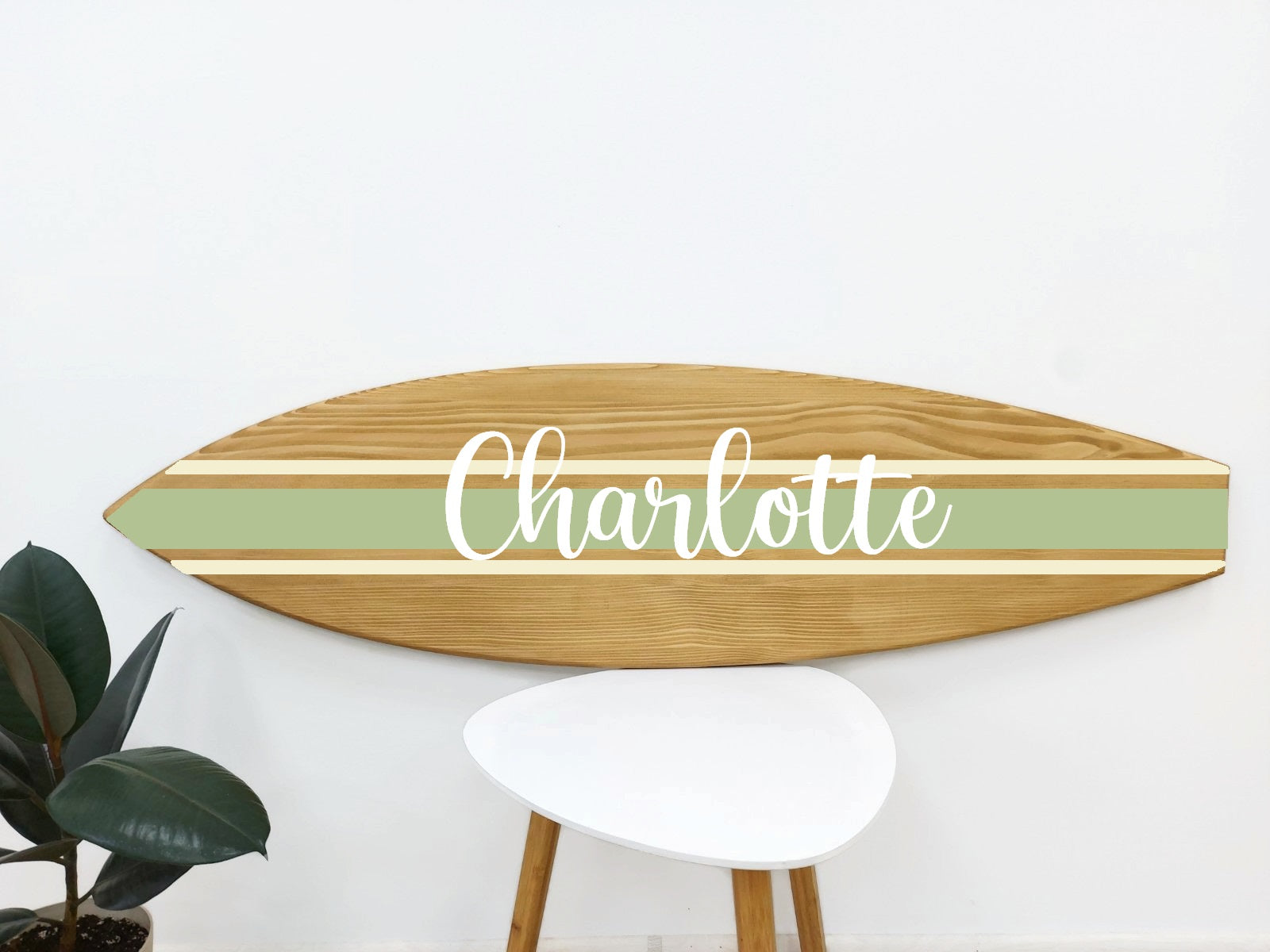 Artisan shaping personalized wooden surfboard art for wall display
