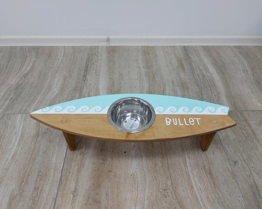 Personalized surfboard-shaped wooden dog bowl holder with pet name painting