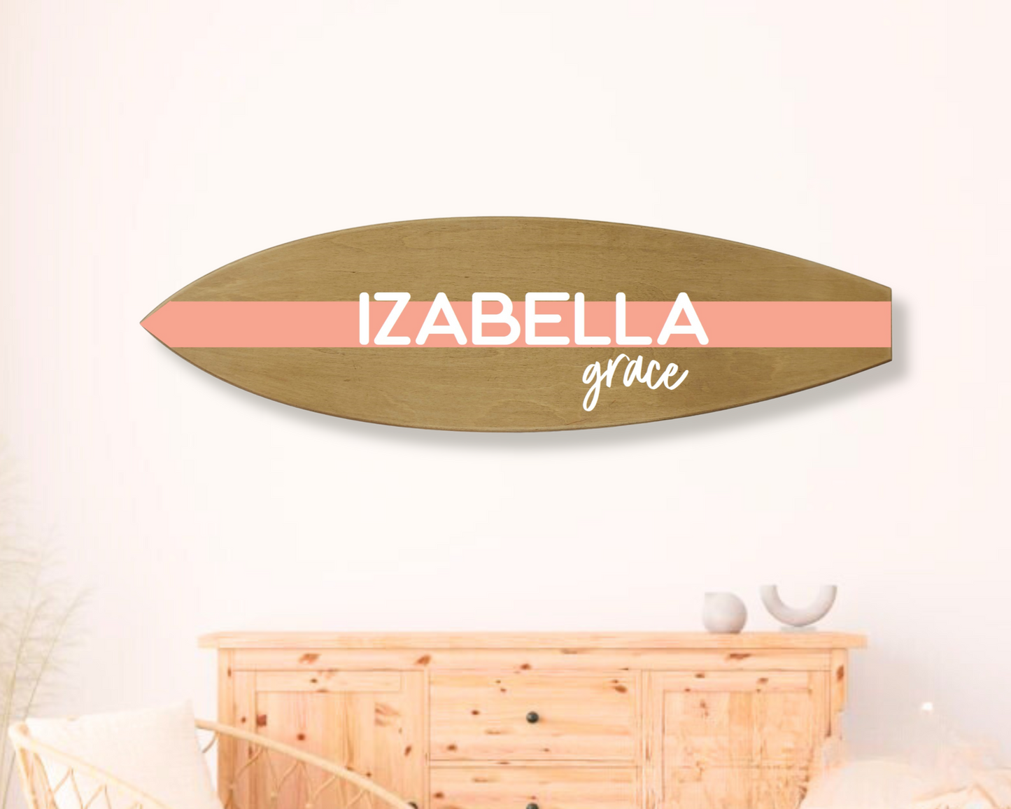 Personalized wooden surfboard sign hanging on nursery or kids’ room wall