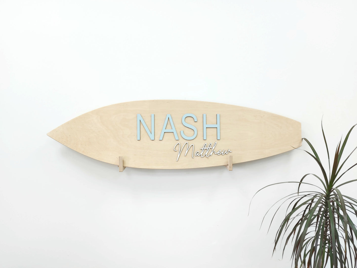 Coastal-themed personalized 3D sign displayed above crib or shelf