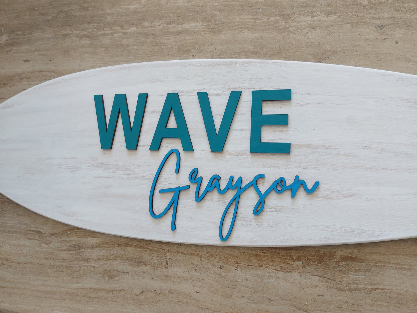 Custom engraved wooden surfboard sign with baby’s name