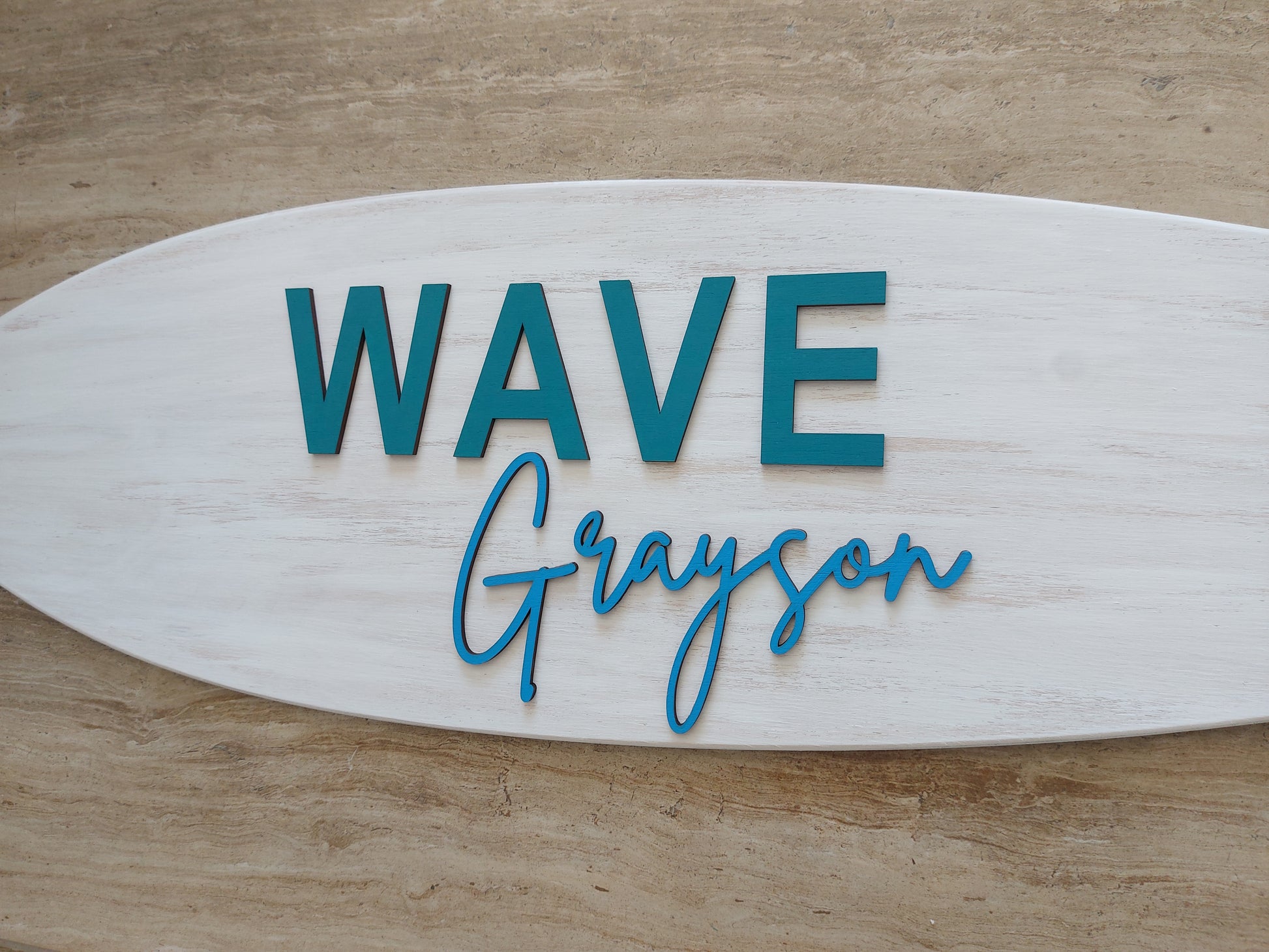 Custom engraved wooden surfboard sign with baby’s name