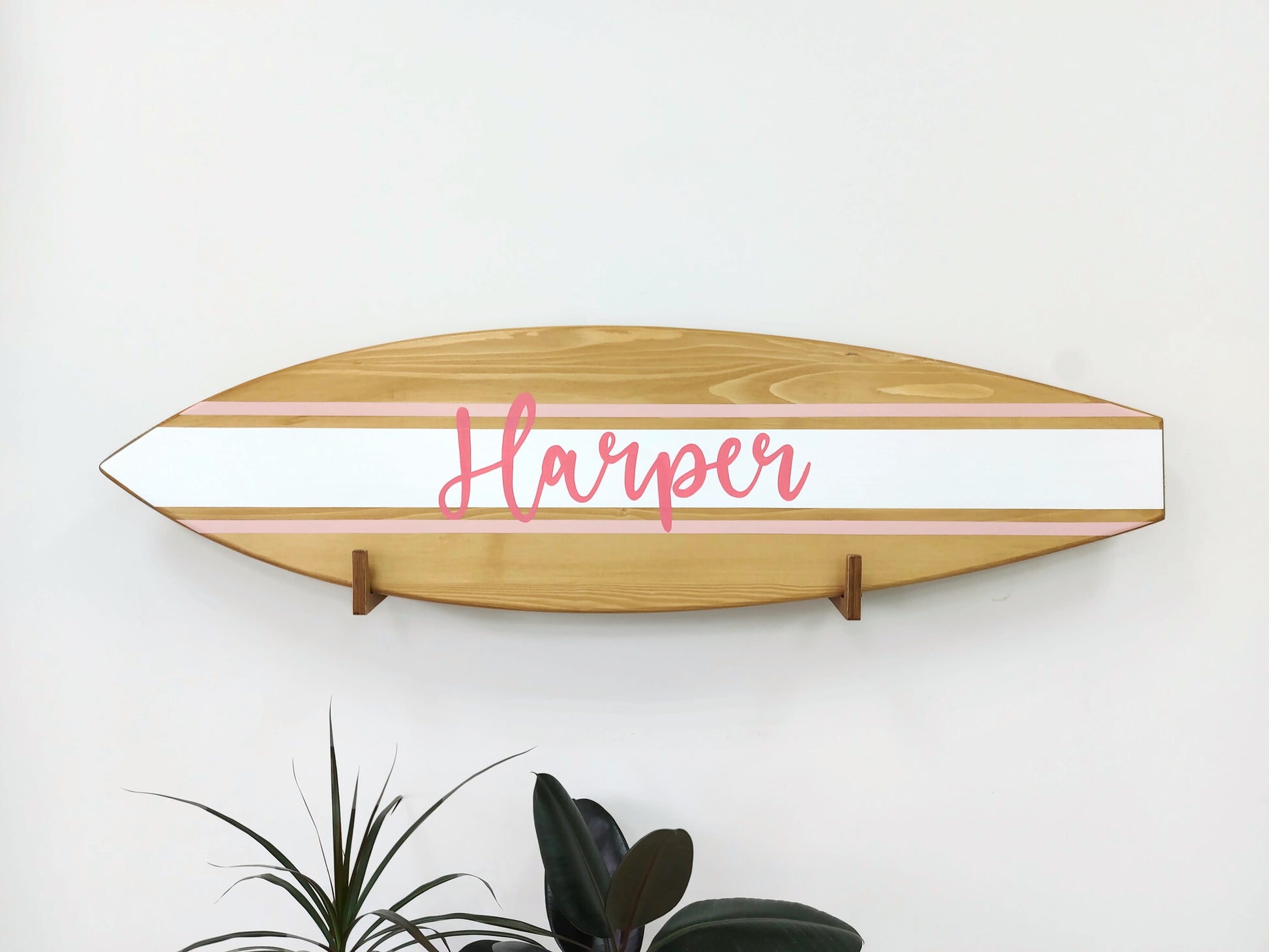Coastal nursery decor with custom wooden above-crib name sign