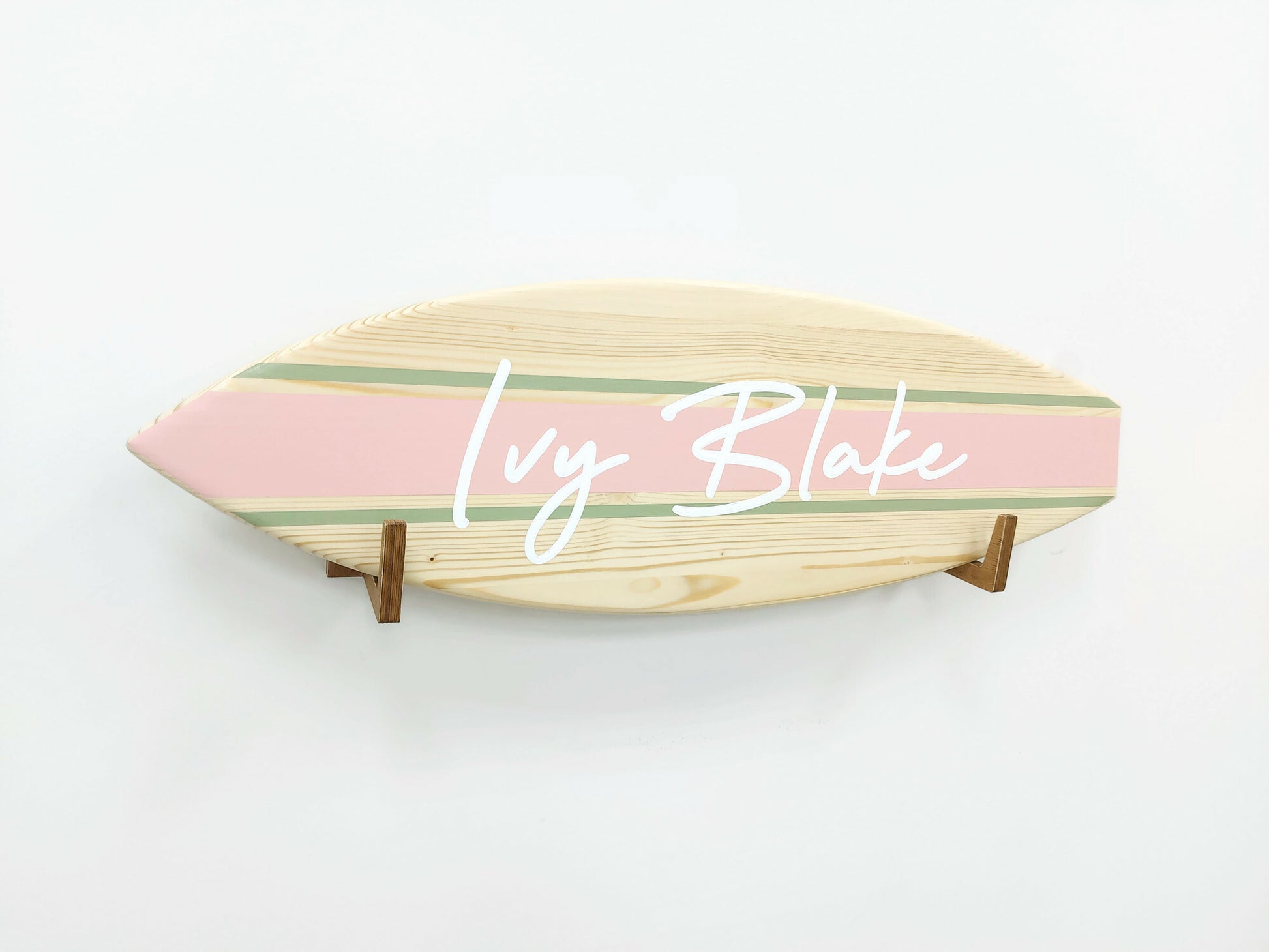 Surfboard-shaped personalized wooden wall decor