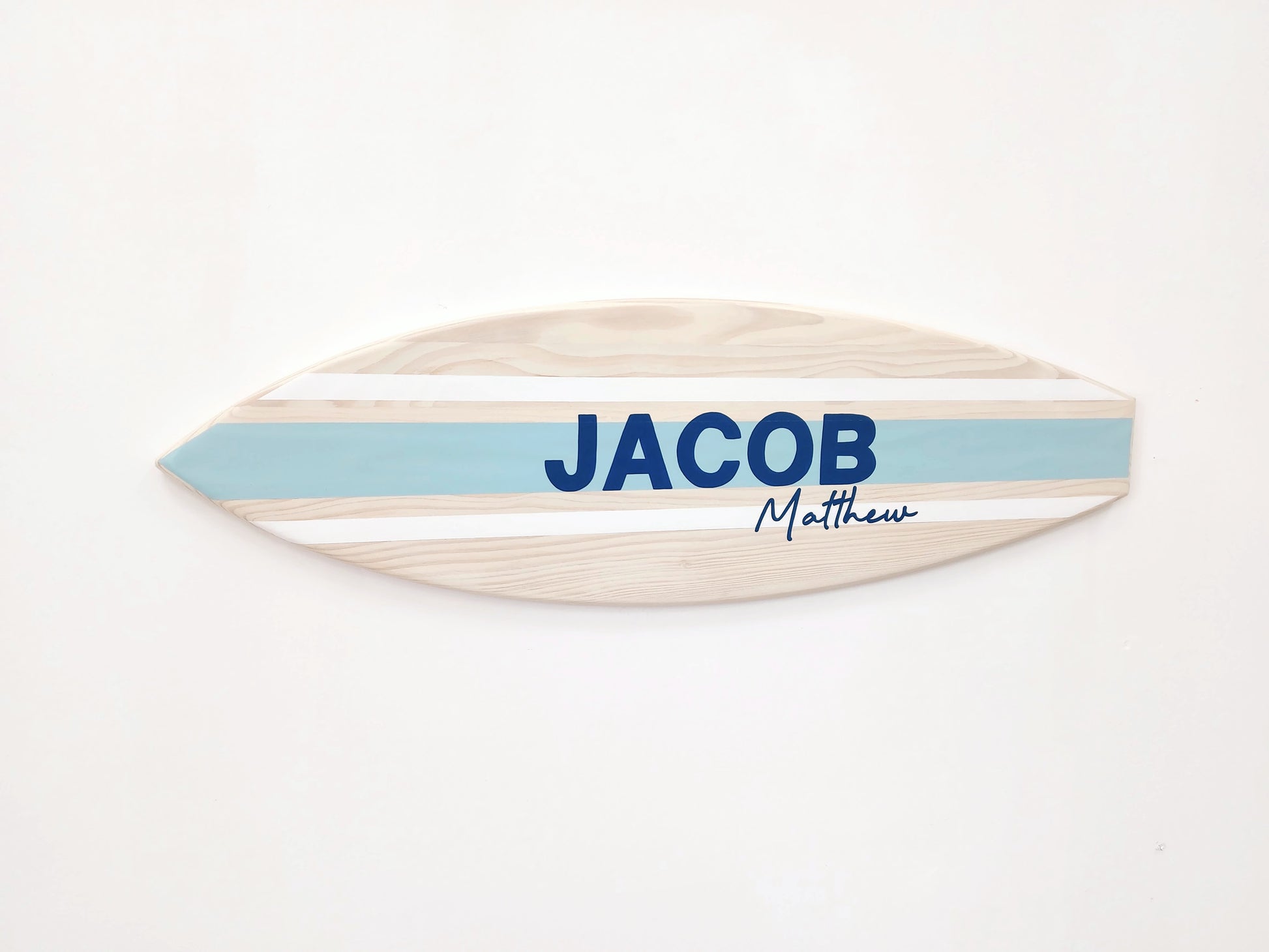 Handmade surfboard decor with engraved name in natural wood finish
