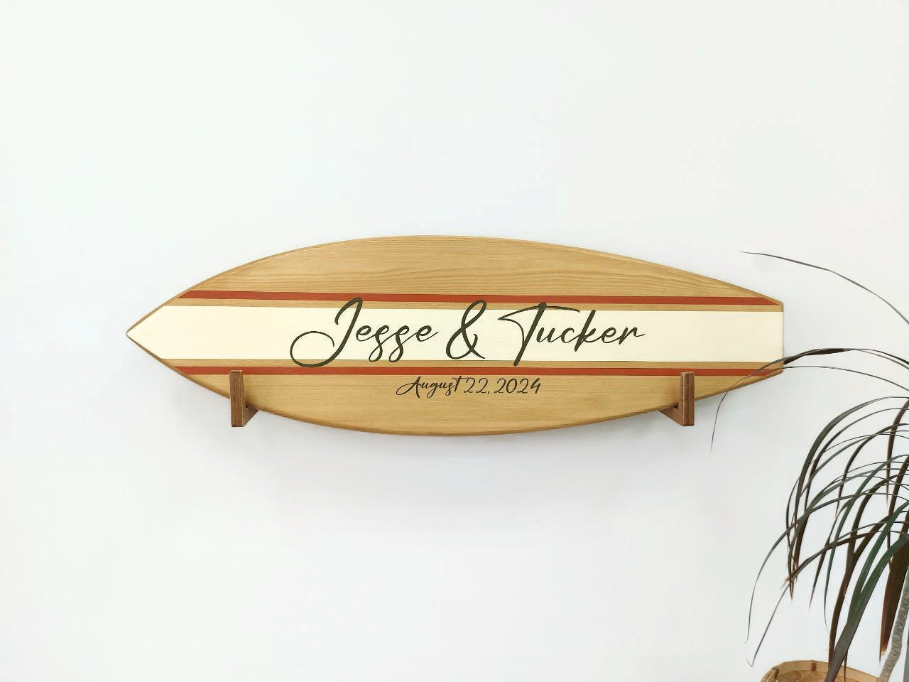 Surfboard wooden sign used as wall décor in beach wedding setup