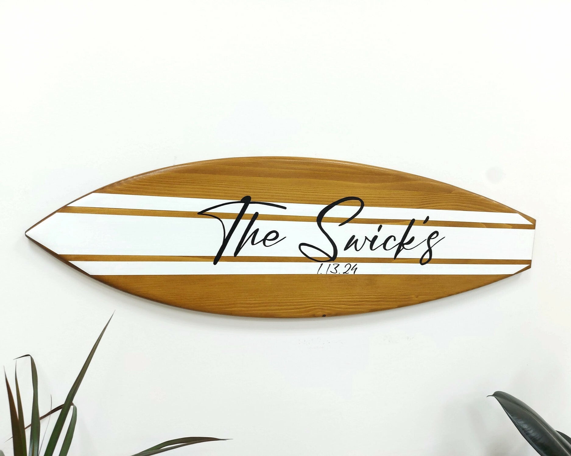 Alternative wedding guest book made from surfboard displayed at ceremony