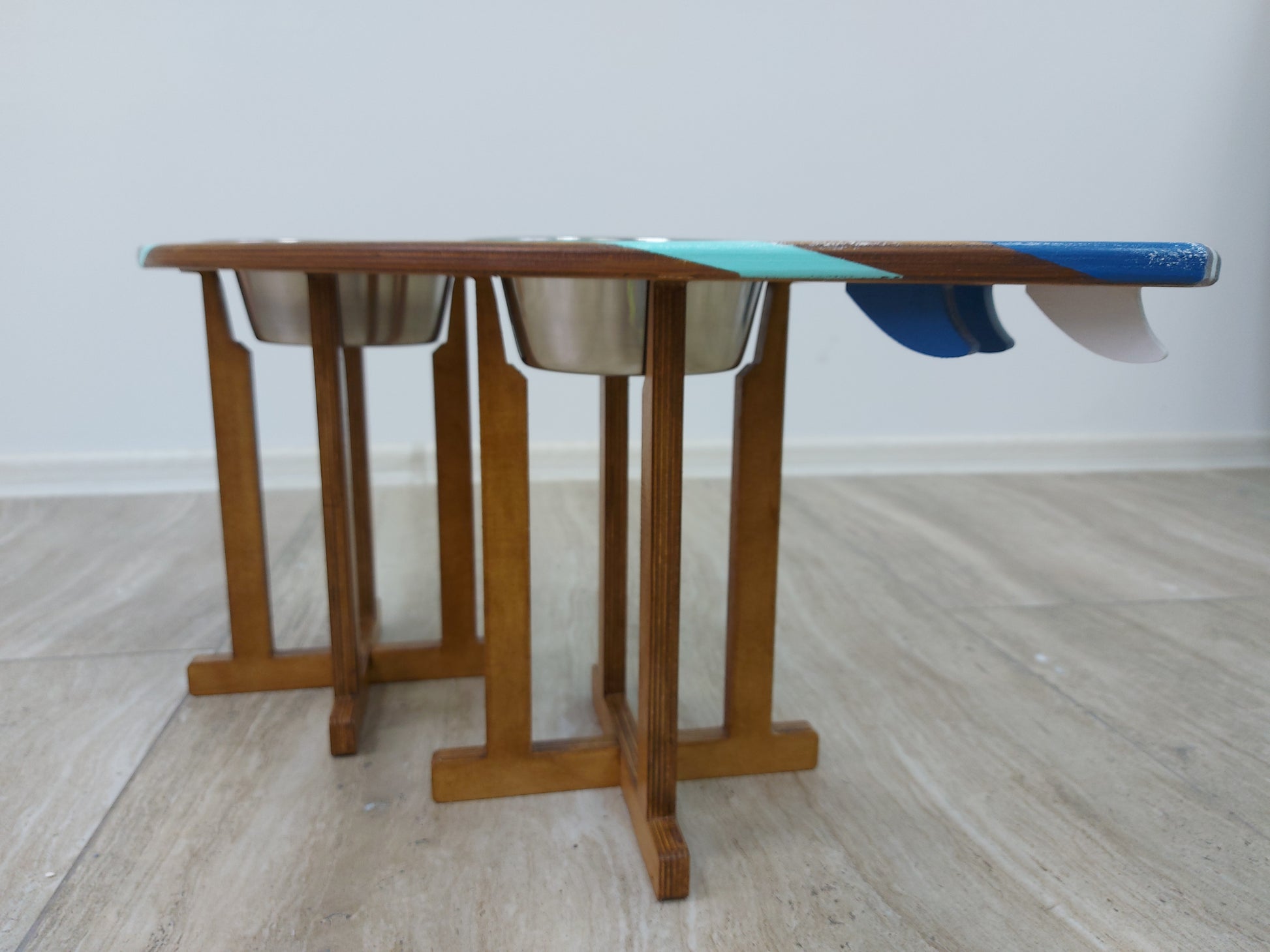 Handmade wooden surfboard pet bowl stand ready for food and water