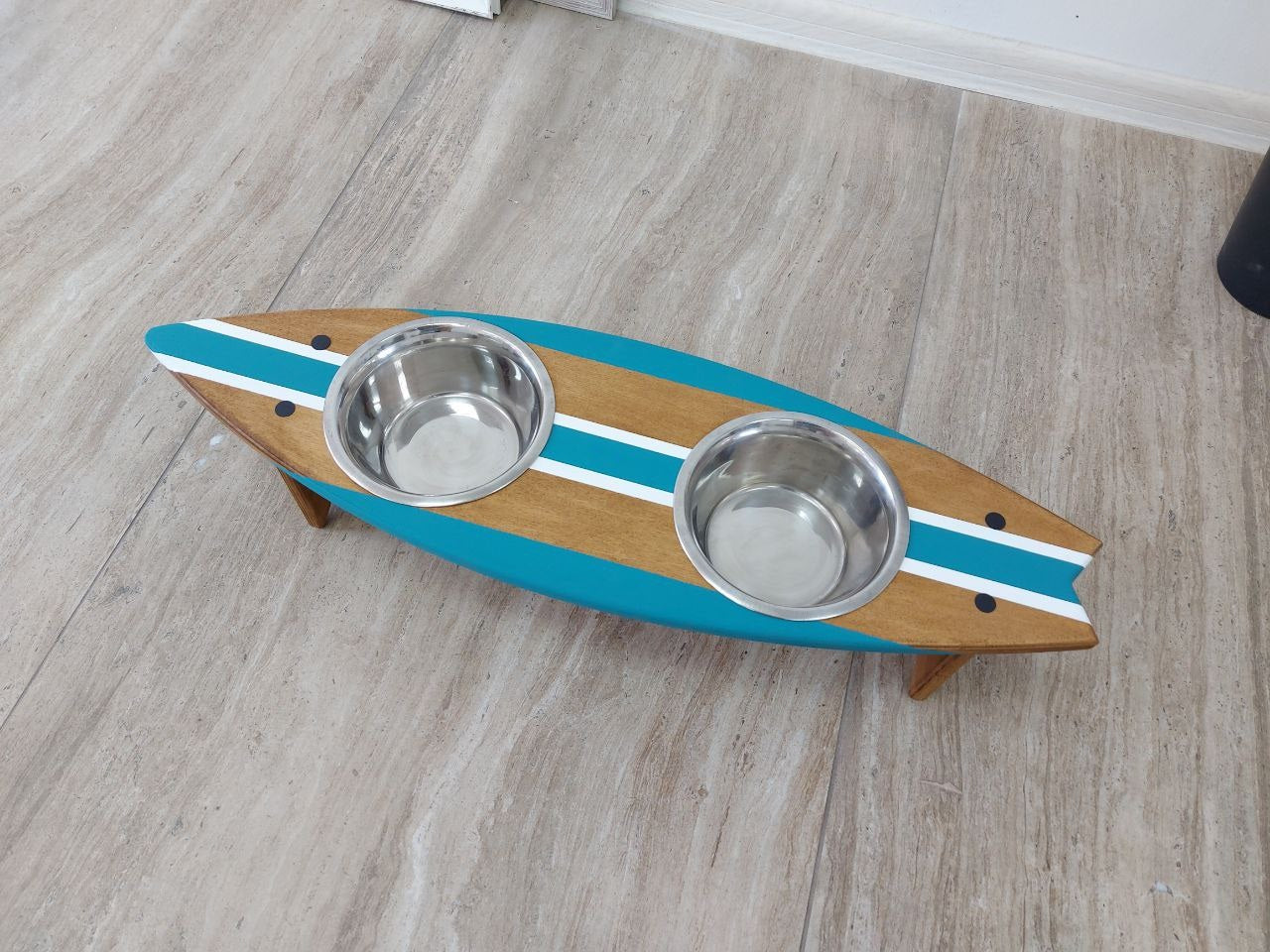 Handmade surfboard-shaped feeding station for dogs