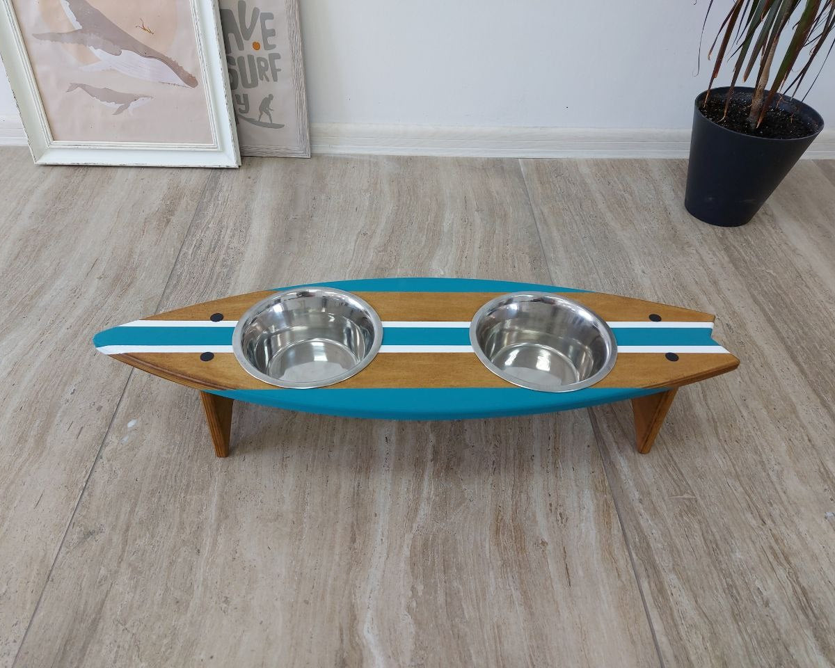 Personalized wooden surfboard dog bowl holder on floor with pet name