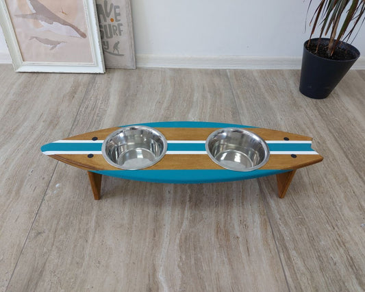 Personalized wooden surfboard dog bowl holder on floor with pet name
