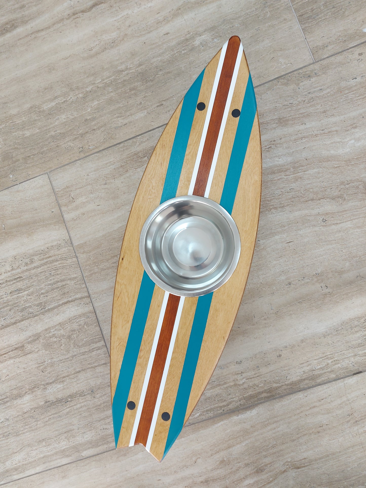 Close-up of custom painted surfboard pet feeding stand