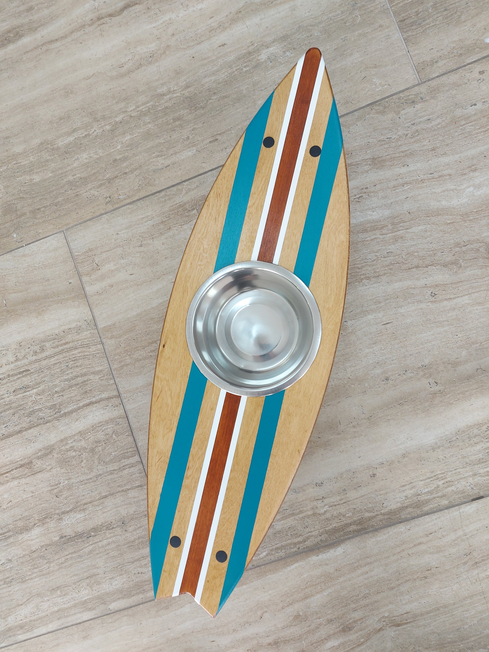 Close-up of custom painted surfboard pet feeding stand