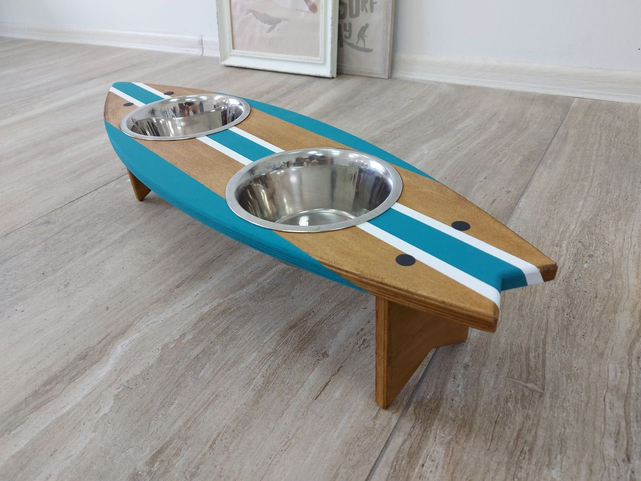 Close-up of custom painted surfboard dog bowl holder
