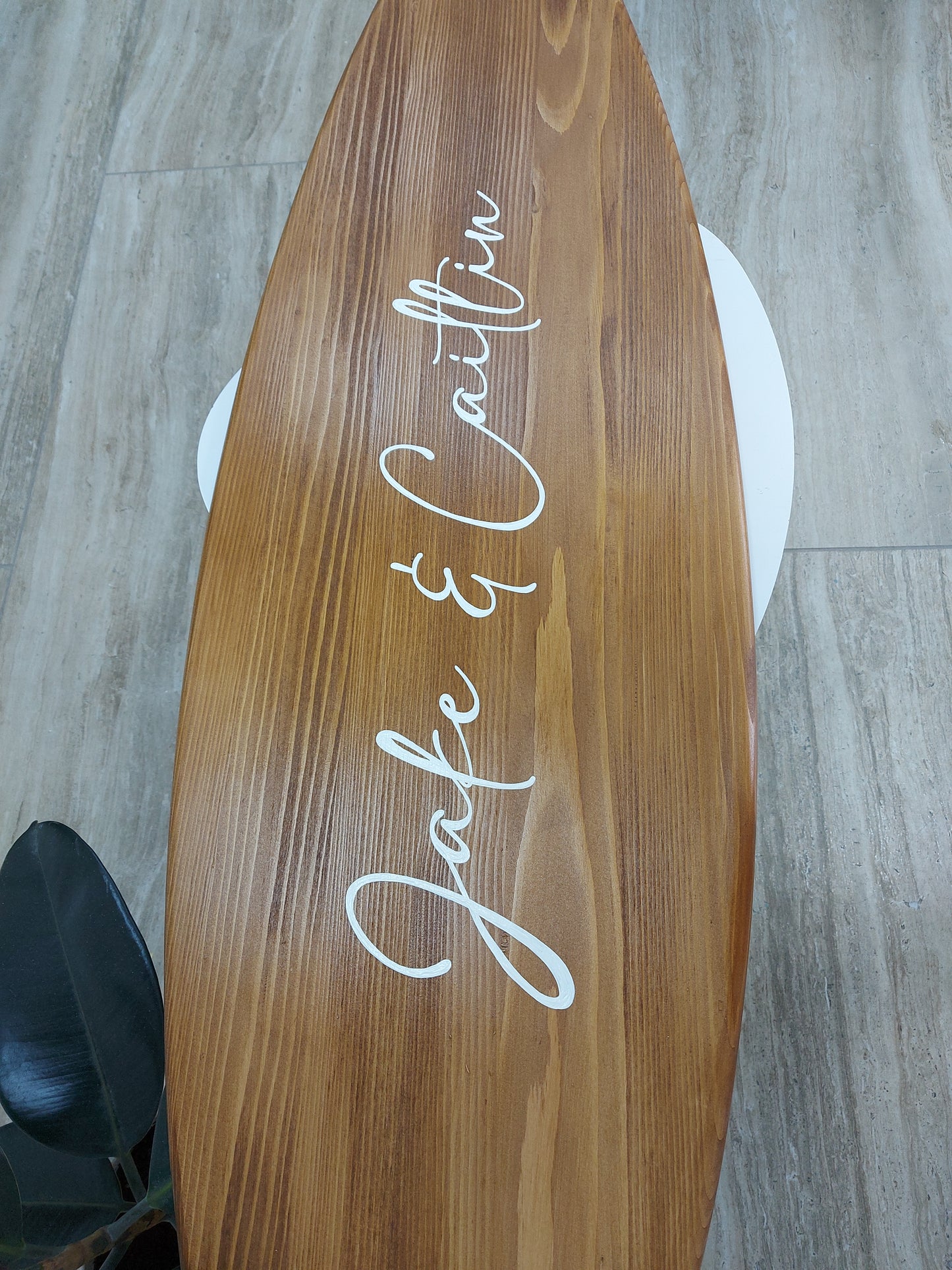 Personalized wooden surfboard wall décor as a wedding guest book with family name design