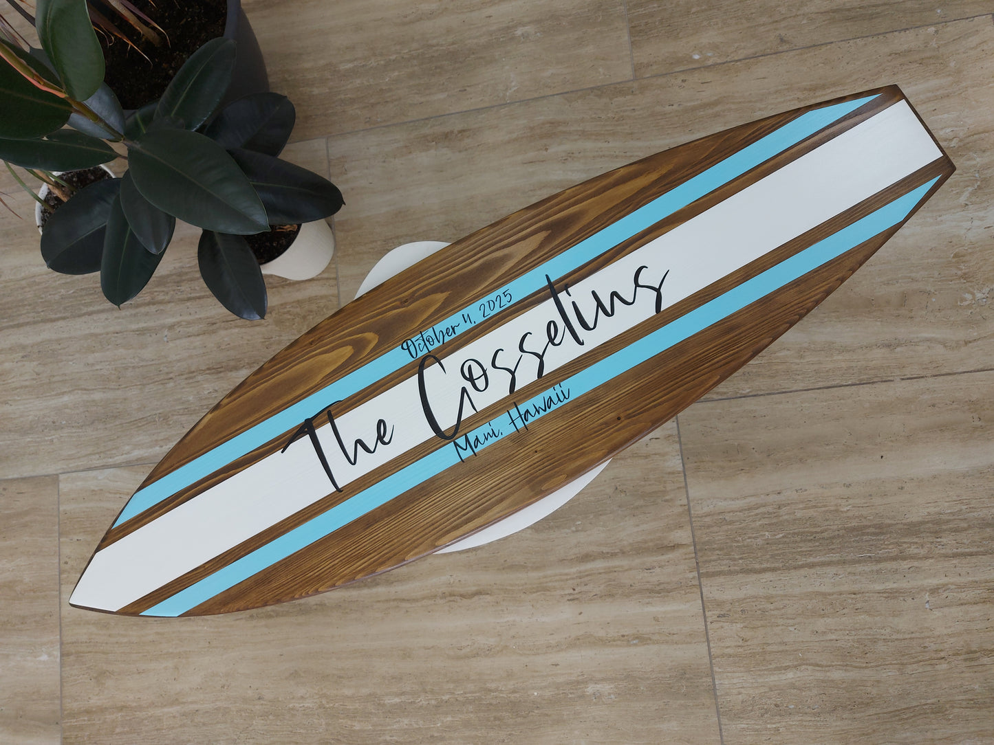 Alternative wedding guest book surfboard displayed at reception