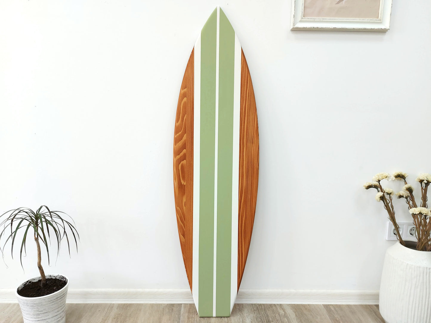 Decorative surfboard wall art in ocean themed room