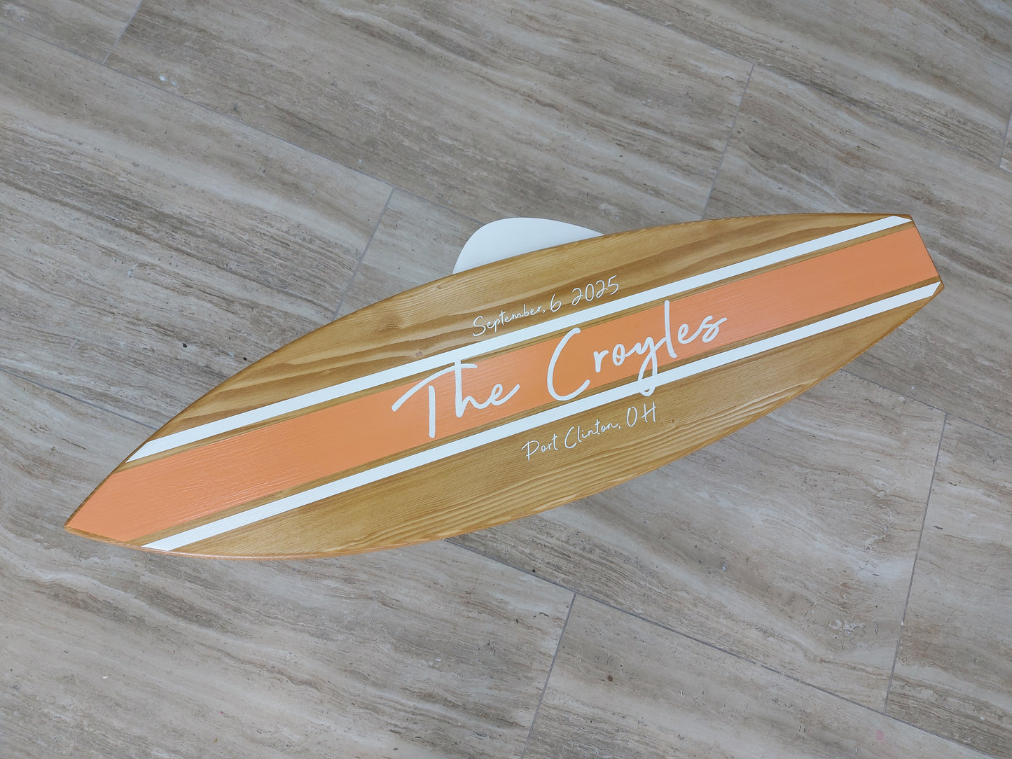 Guests signing wooden surfboard wedding guest book alternative