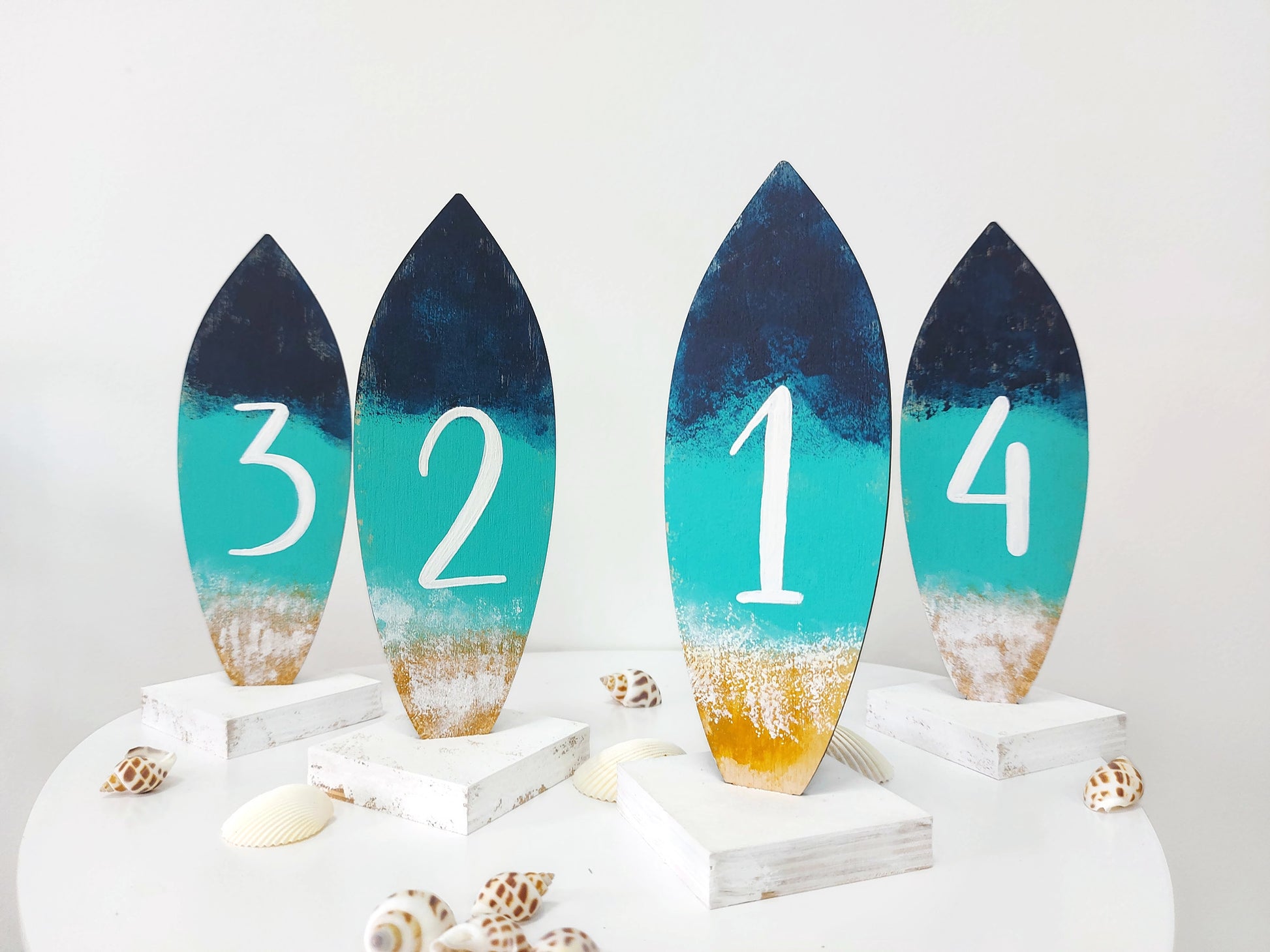 Beach wedding décor wooden table numbers coastal style reception