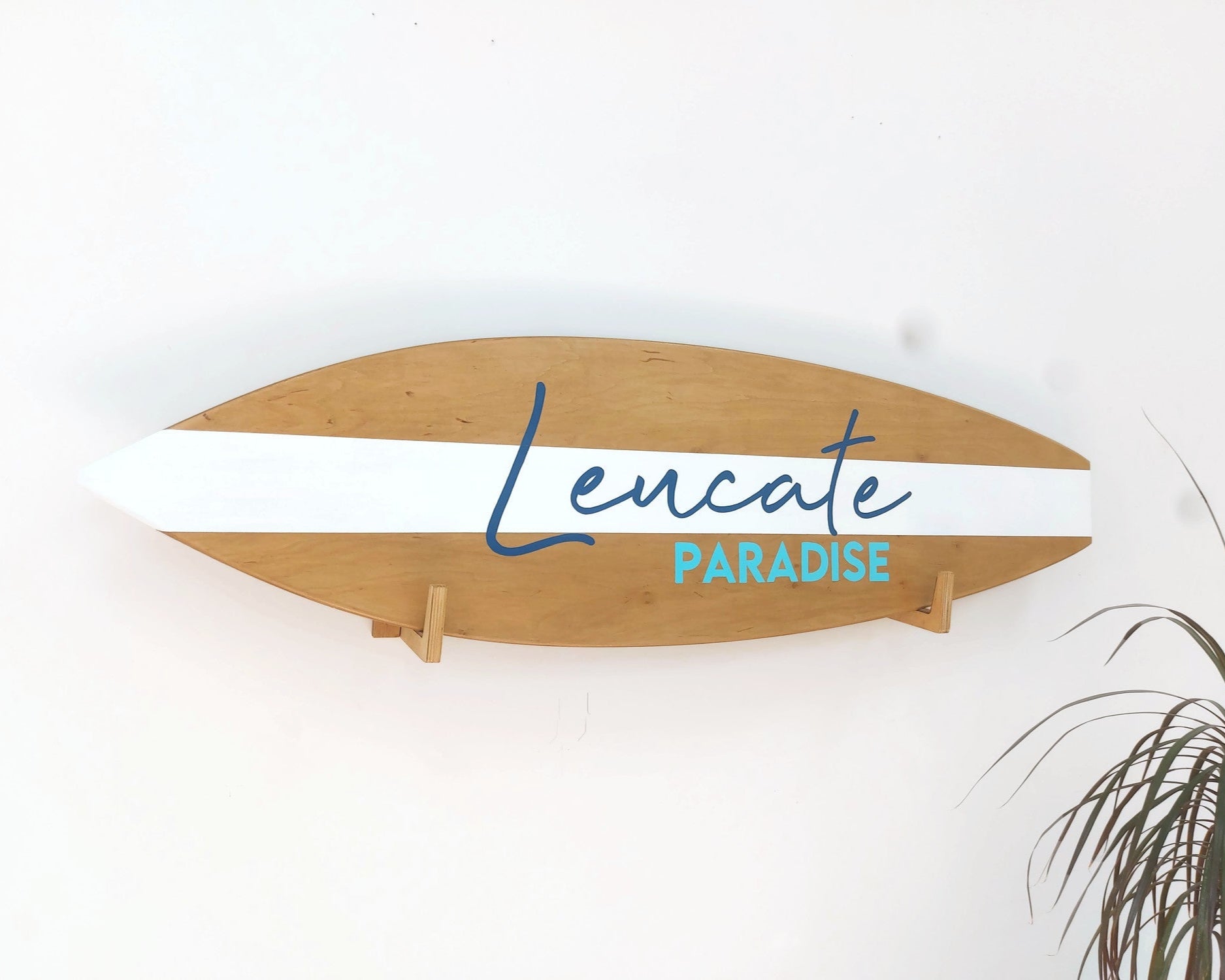 Personalized surfboard wood sign hanging on nursery wall