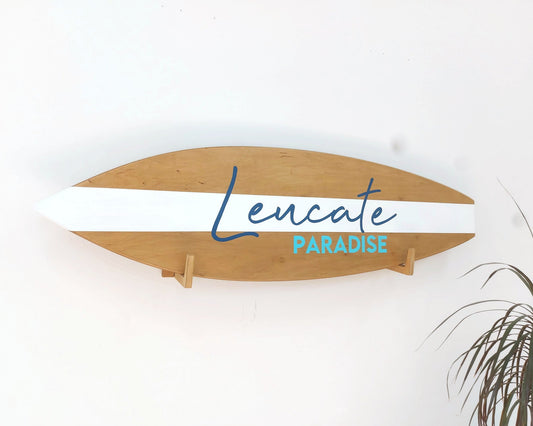 Personalized surfboard wood sign hanging on nursery wall