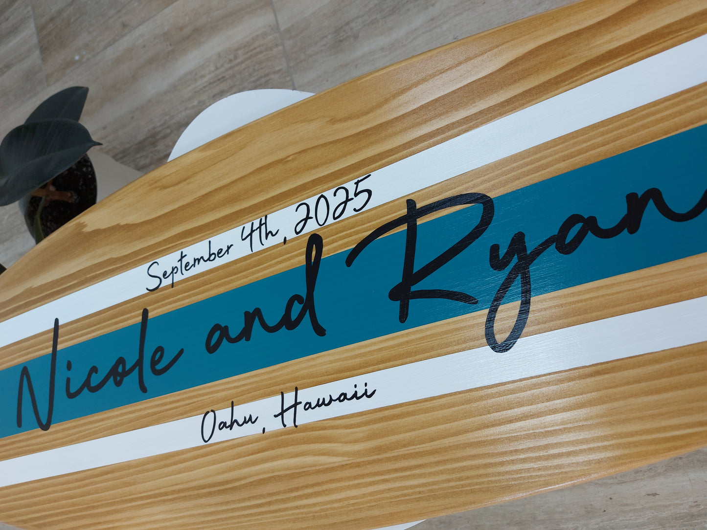 Wood surfboard wall décor used as wedding guest book alternative