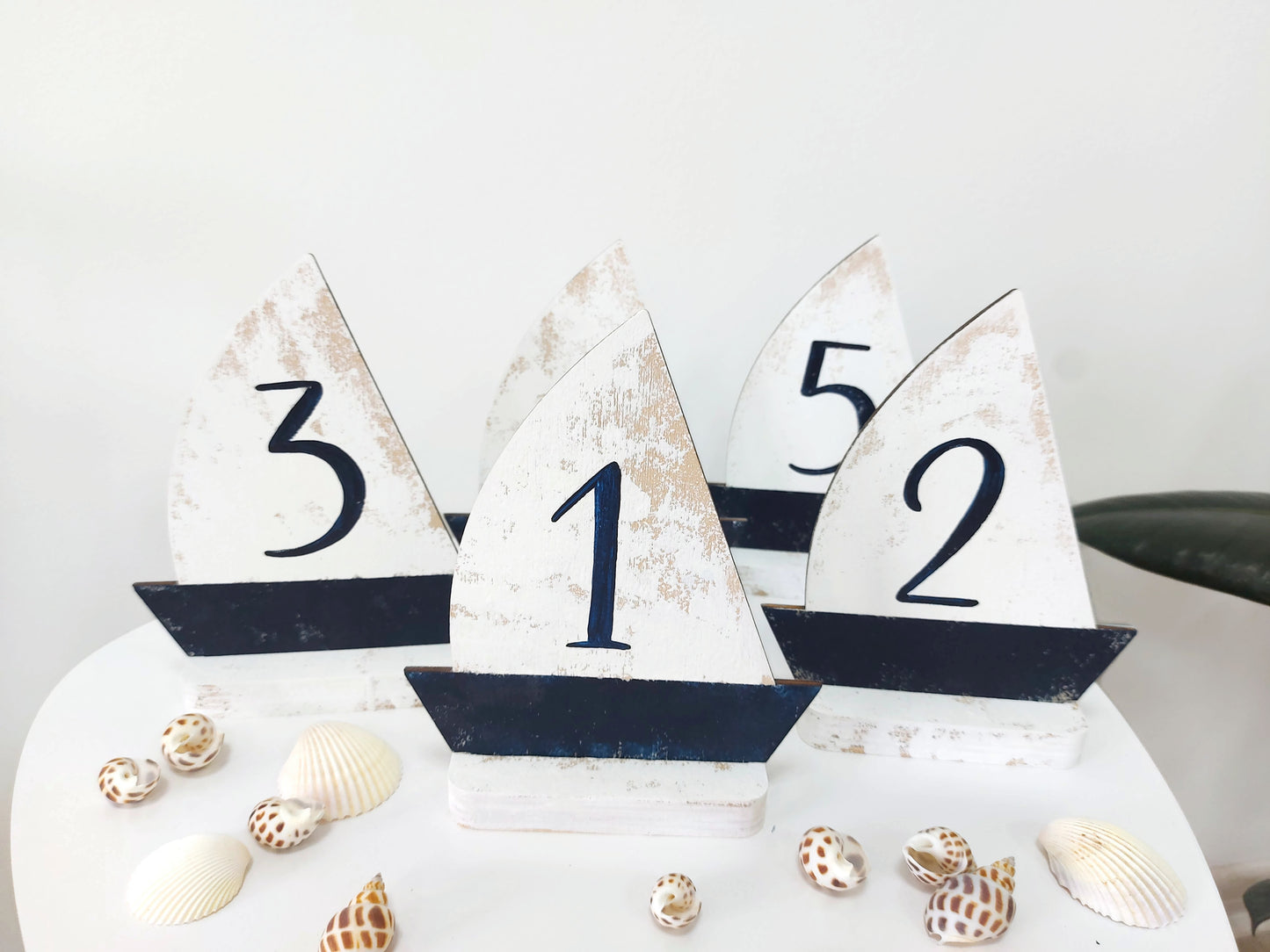 Beach wedding table decor with coastal style wooden numbers