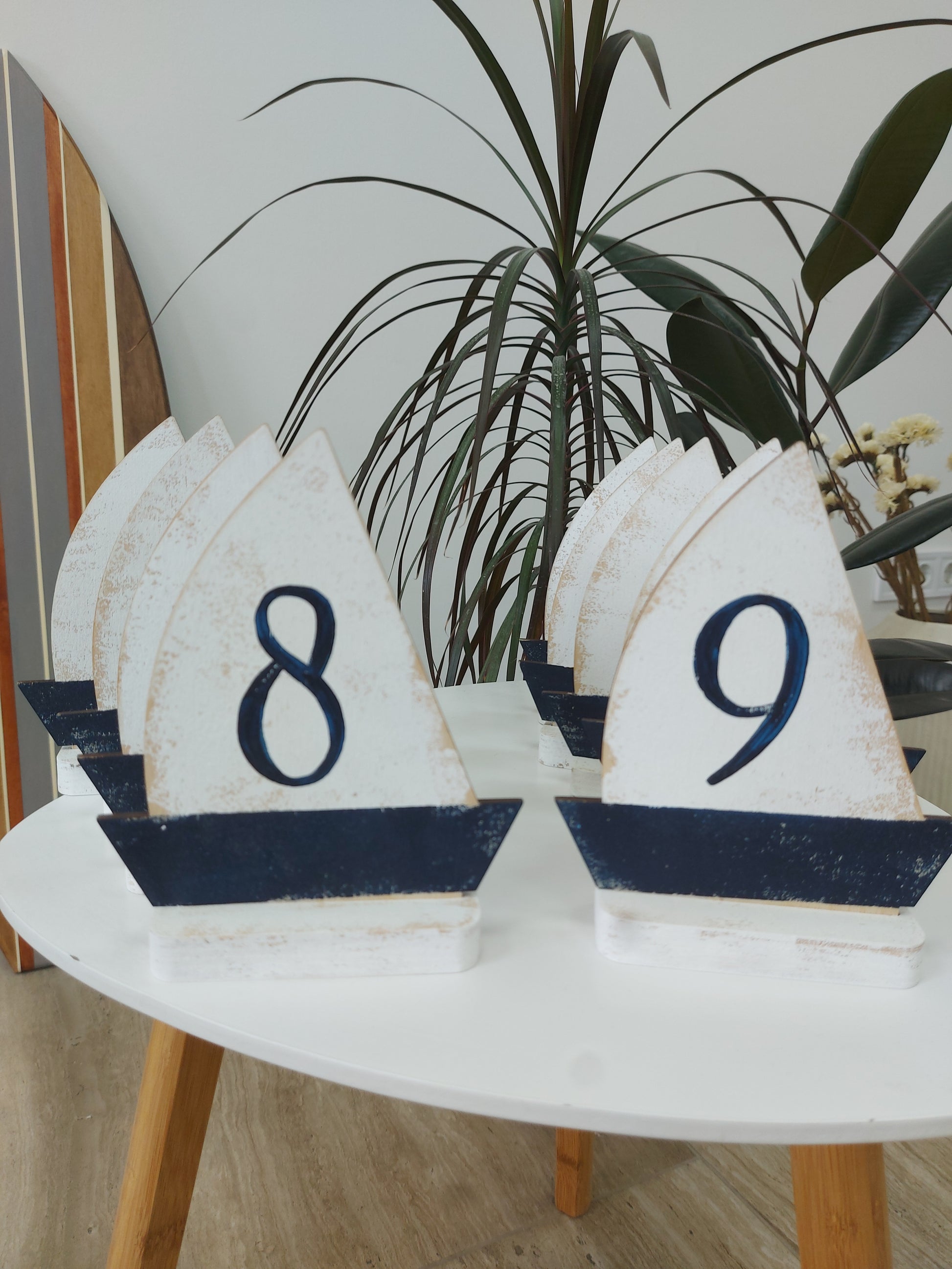 Decorative ocean beach wedding table numbers on a white background