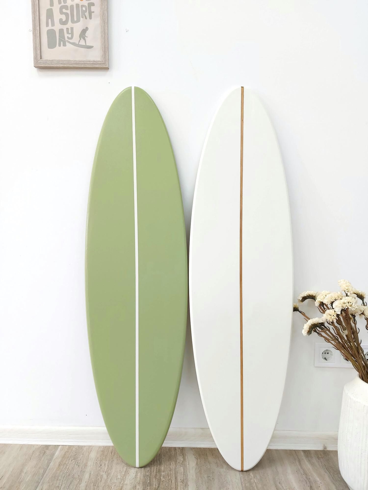 Nautical wall art surfboard décor displayed in modern interior