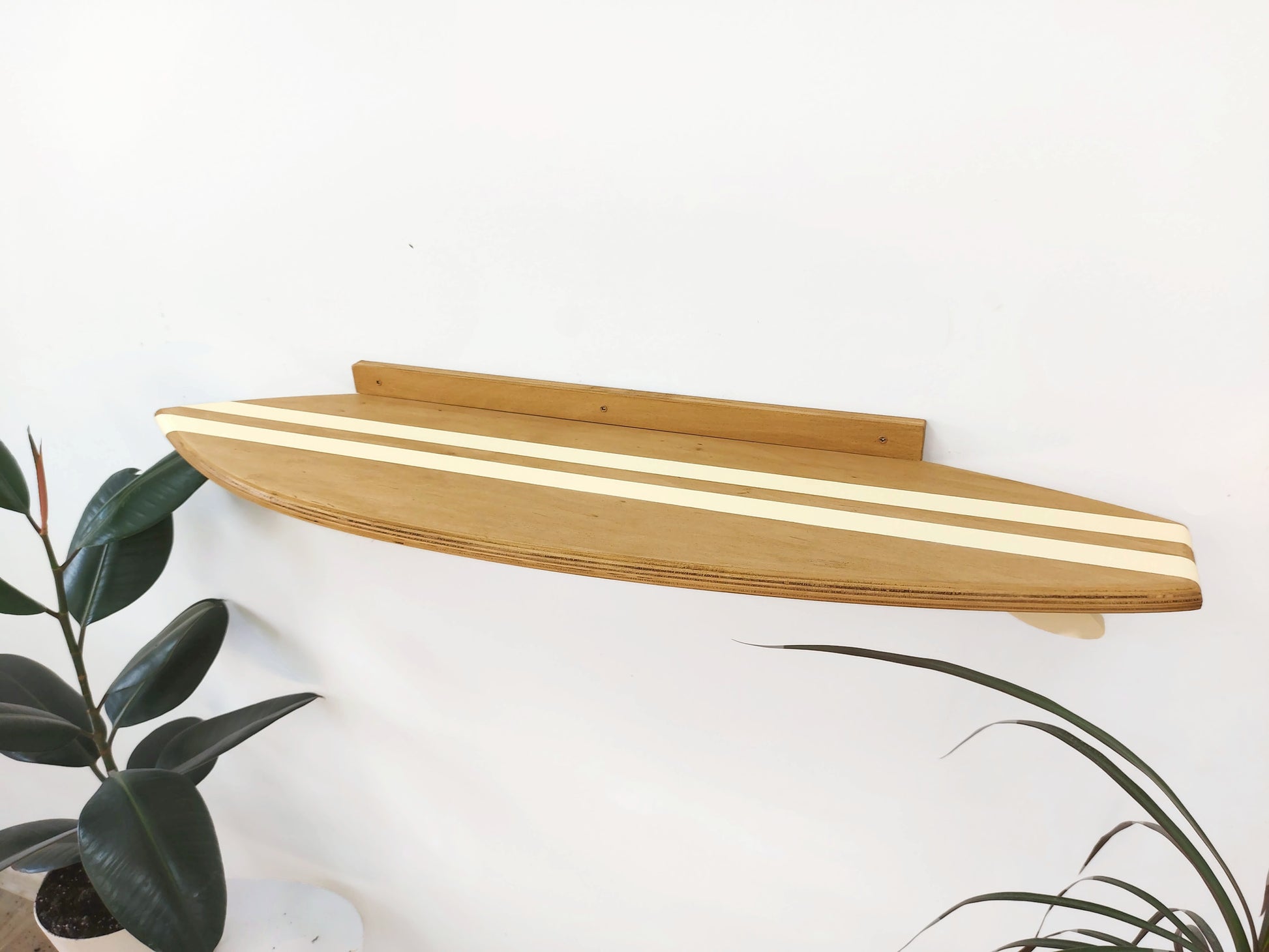 Surfboard-shaped wooden shelf for surfboard home décor