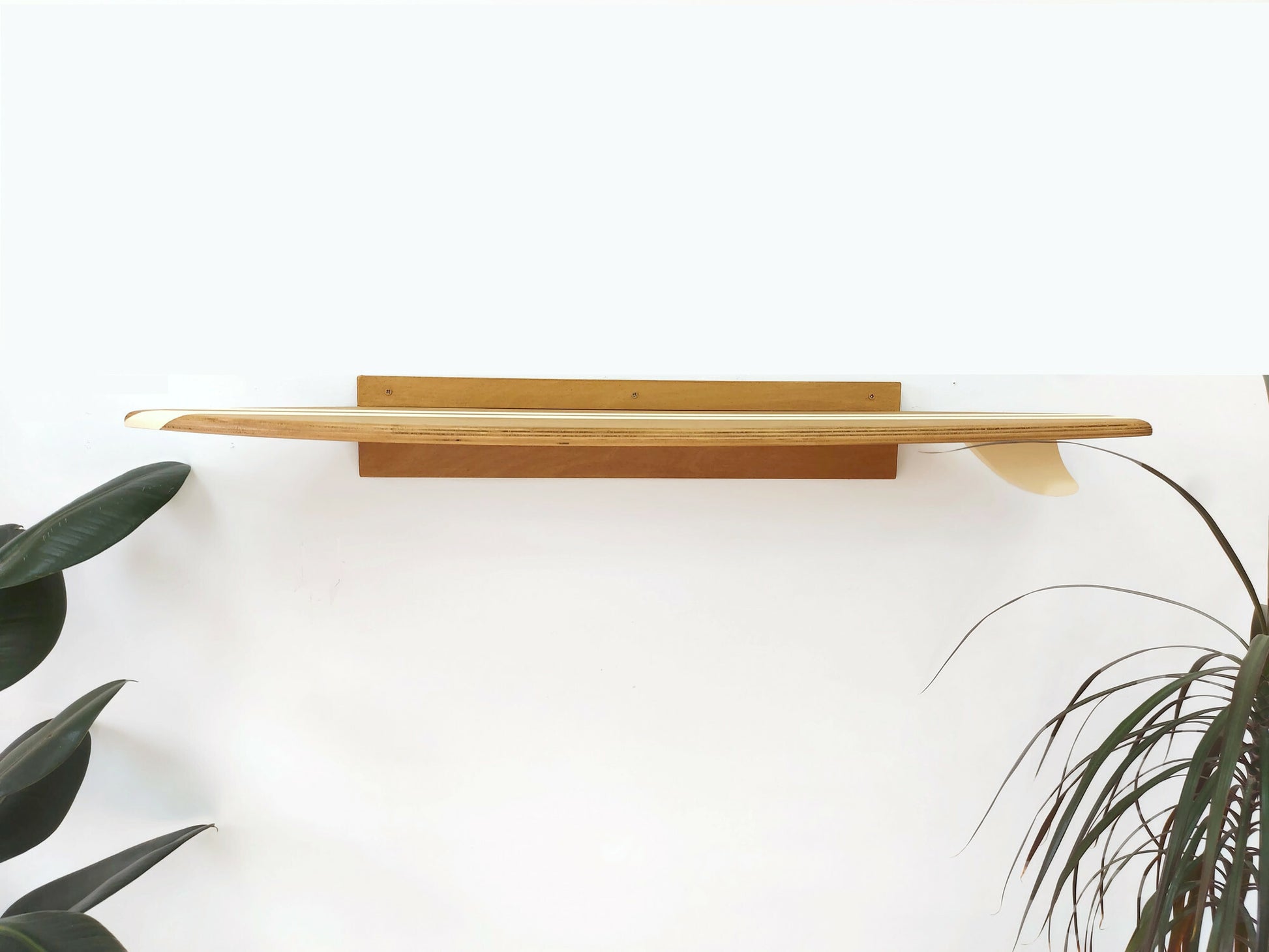 Decorative surfboard shelf wall art and tabletop accent in coastal interior