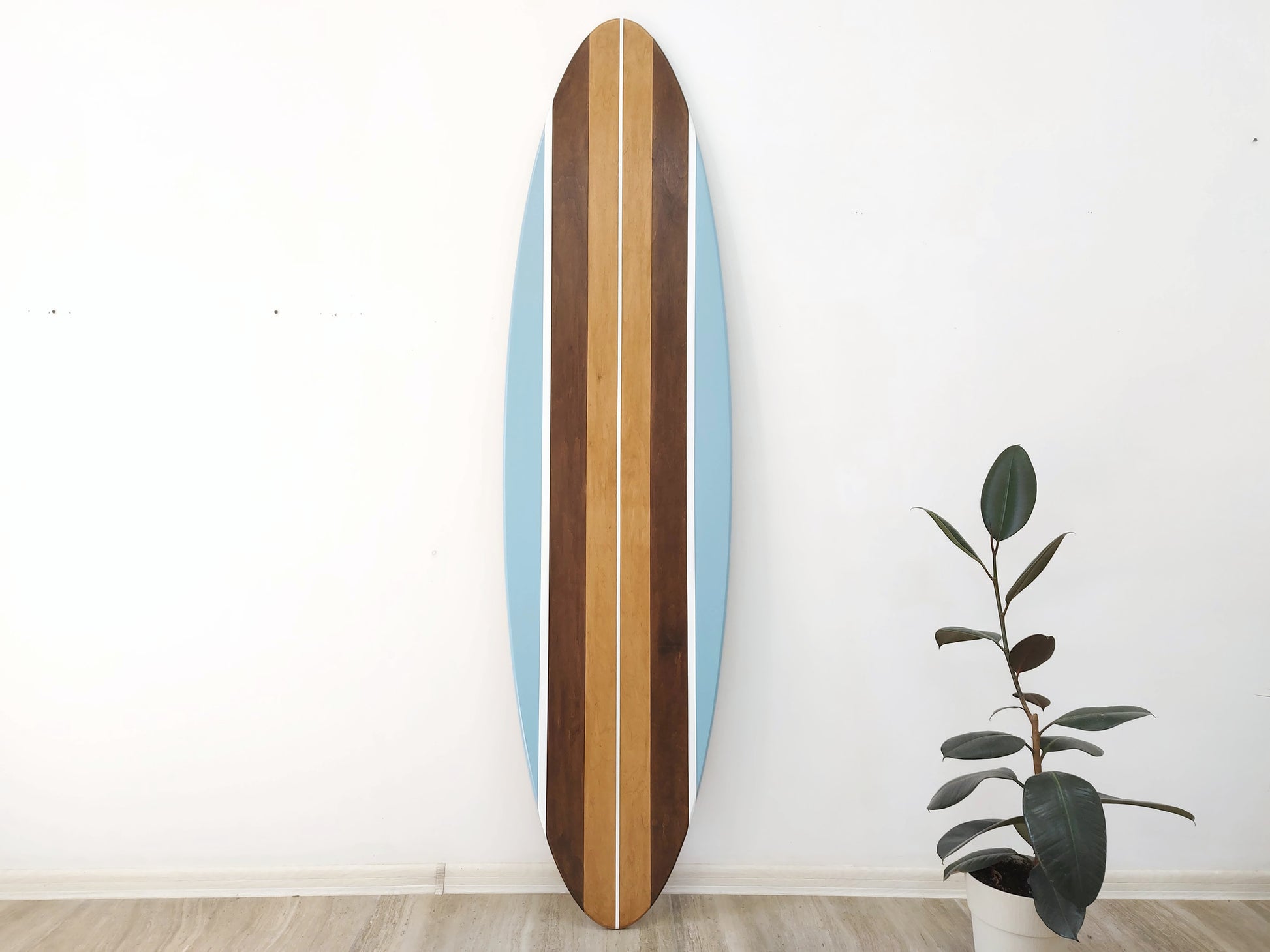 Surfboard home decor hanging on wall in beach house