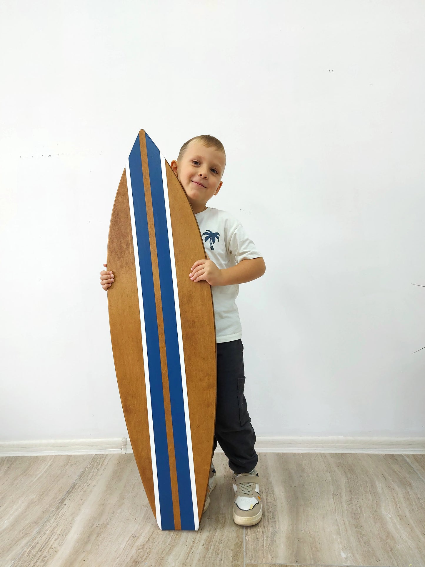 Wooden surfboard wall art accent piece for modern coastal interior design