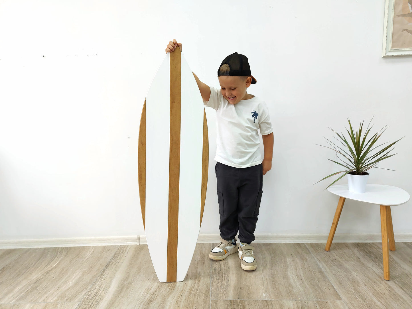 Handmade wooden surfboard wall decoration, side profile showing natural finish