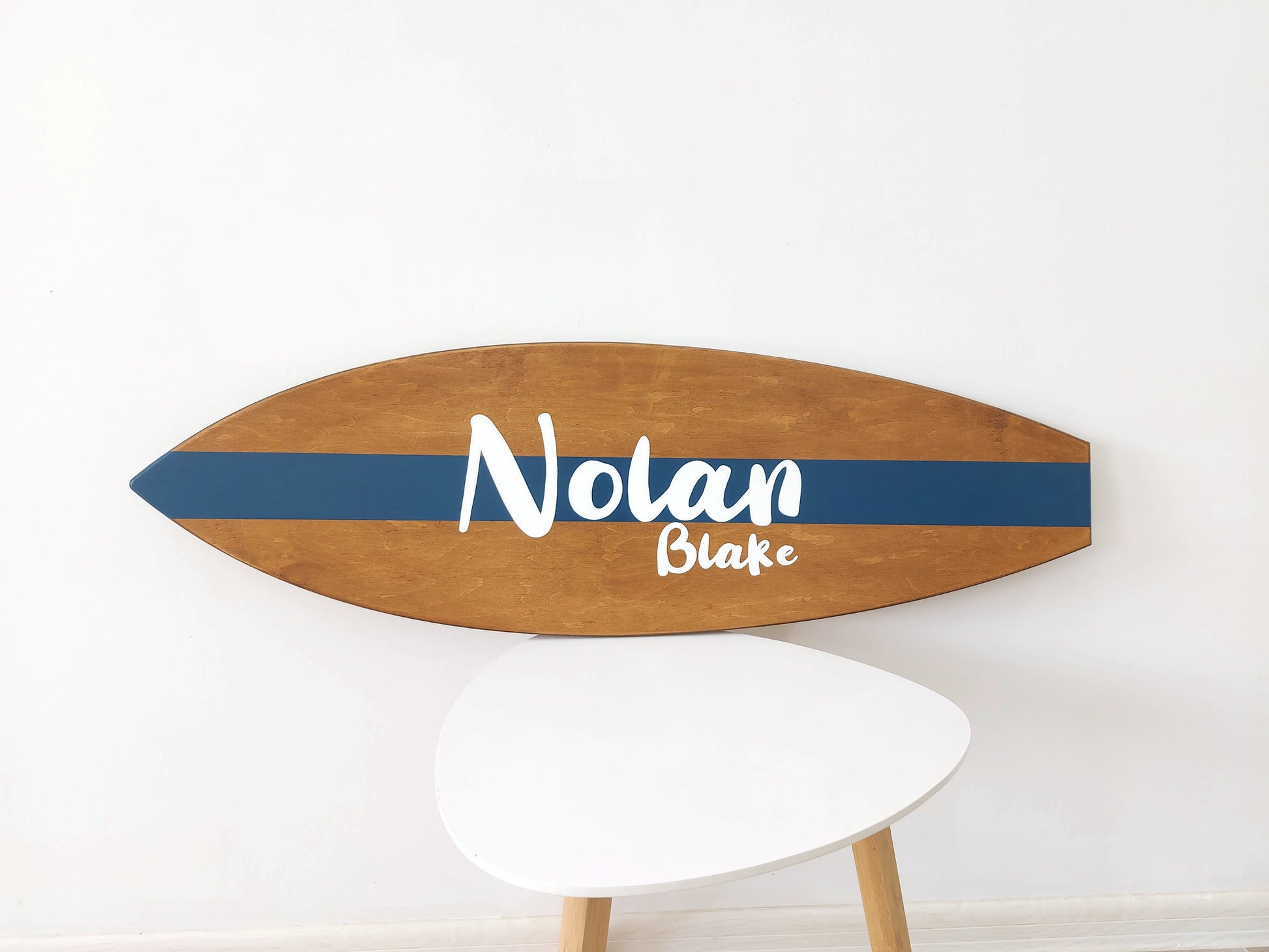 Personalized wooden surfboard wall art for nursery or beach-themed room
